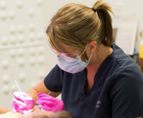 dental team member working on patient